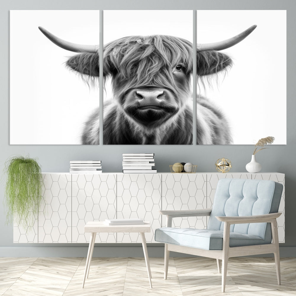 A three-panel wall art from the Highland Cow Animal Canvas series showcases a long-haired, large-horned cow. This Texas Cattle Art Print is crafted on museum-quality canvas with a UV-protective coating, making it an ideal addition to transform your living room.