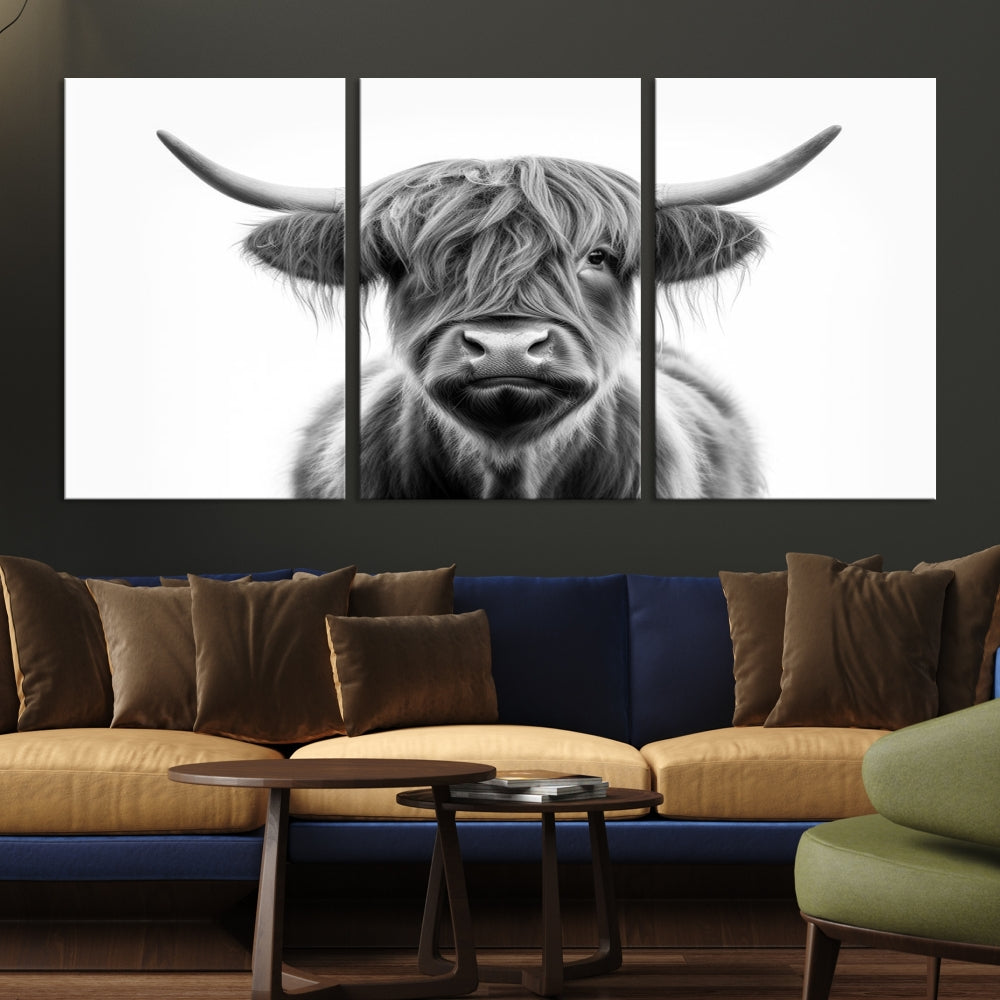 A three-panel wall art from the Highland Cow Animal Canvas series showcases a long-haired, large-horned cow. This Texas Cattle Art Print is crafted on museum-quality canvas with a UV-protective coating, making it an ideal addition to transform your living room.