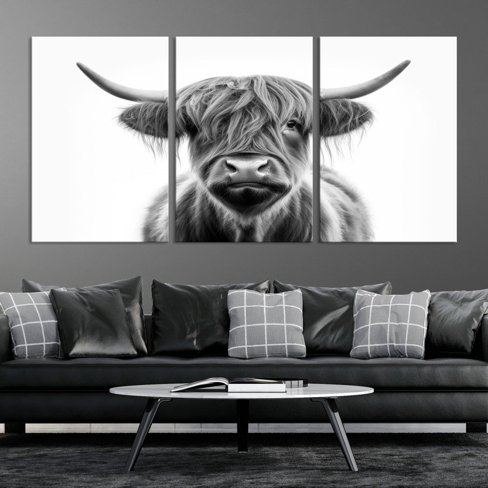 A three-panel wall art from the Highland Cow Animal Canvas series showcases a long-haired, large-horned cow. This Texas Cattle Art Print is crafted on museum-quality canvas with a UV-protective coating, making it an ideal addition to transform your living room.