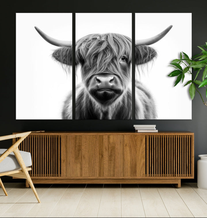 A three-panel wall art from the Highland Cow Animal Canvas series showcases a long-haired, large-horned cow. This Texas Cattle Art Print is crafted on museum-quality canvas with a UV-protective coating, making it an ideal addition to transform your living room.