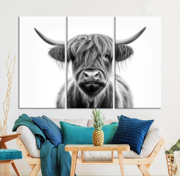 A three-panel wall art from the Highland Cow Animal Canvas series showcases a long-haired, large-horned cow. This Texas Cattle Art Print is crafted on museum-quality canvas with a UV-protective coating, making it an ideal addition to transform your living room.