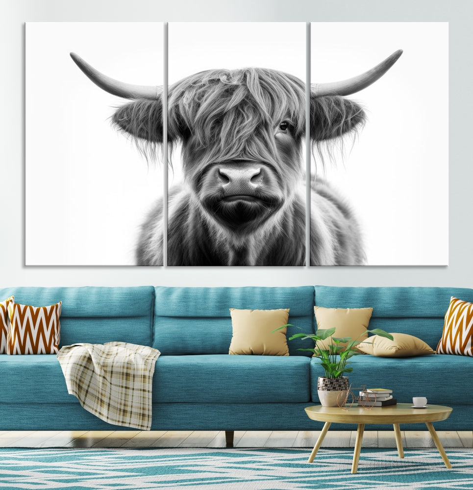 A three-panel wall art from the Highland Cow Animal Canvas series showcases a long-haired, large-horned cow. This Texas Cattle Art Print is crafted on museum-quality canvas with a UV-protective coating, making it an ideal addition to transform your living room.