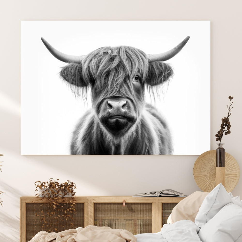 A three-panel wall art from the Highland Cow Animal Canvas series showcases a long-haired, large-horned cow. This Texas Cattle Art Print is crafted on museum-quality canvas with a UV-protective coating, making it an ideal addition to transform your living room.