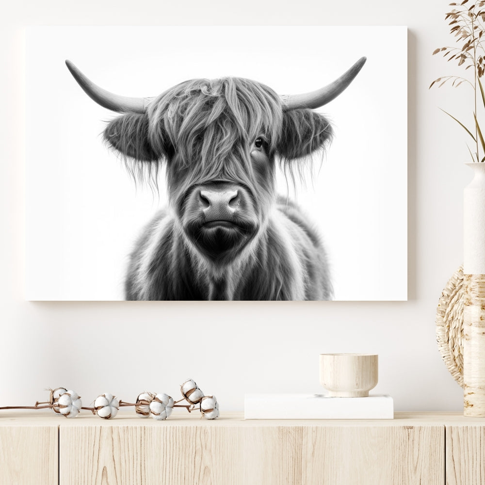 A three-panel wall art from the Highland Cow Animal Canvas series showcases a long-haired, large-horned cow. This Texas Cattle Art Print is crafted on museum-quality canvas with a UV-protective coating, making it an ideal addition to transform your living room.