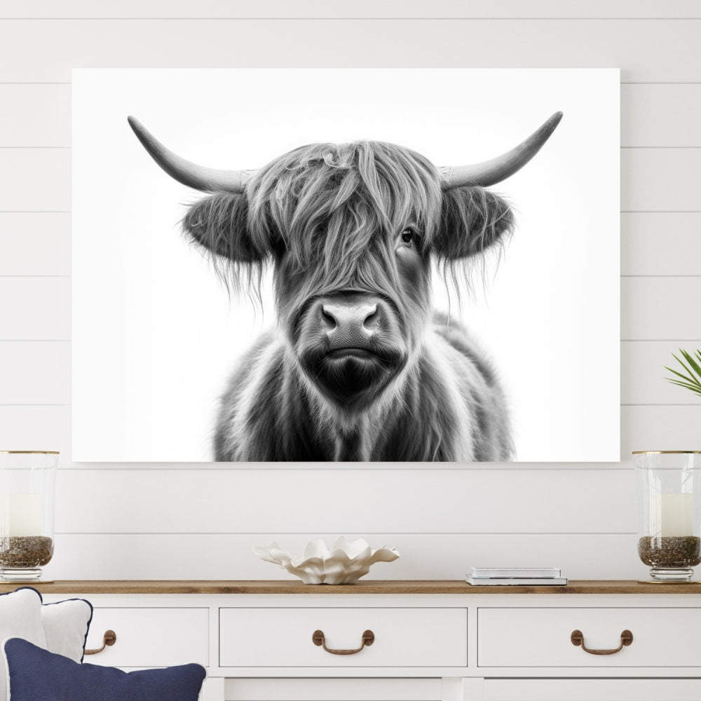 A three-panel wall art from the Highland Cow Animal Canvas series showcases a long-haired, large-horned cow. This Texas Cattle Art Print is crafted on museum-quality canvas with a UV-protective coating, making it an ideal addition to transform your living room.