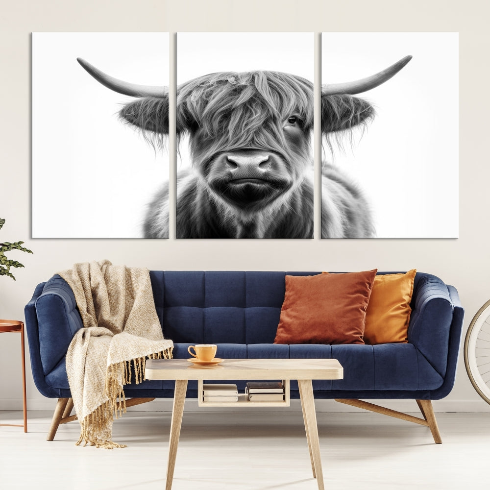 A three-panel wall art from the Highland Cow Animal Canvas series showcases a long-haired, large-horned cow. This Texas Cattle Art Print is crafted on museum-quality canvas with a UV-protective coating, making it an ideal addition to transform your living room.