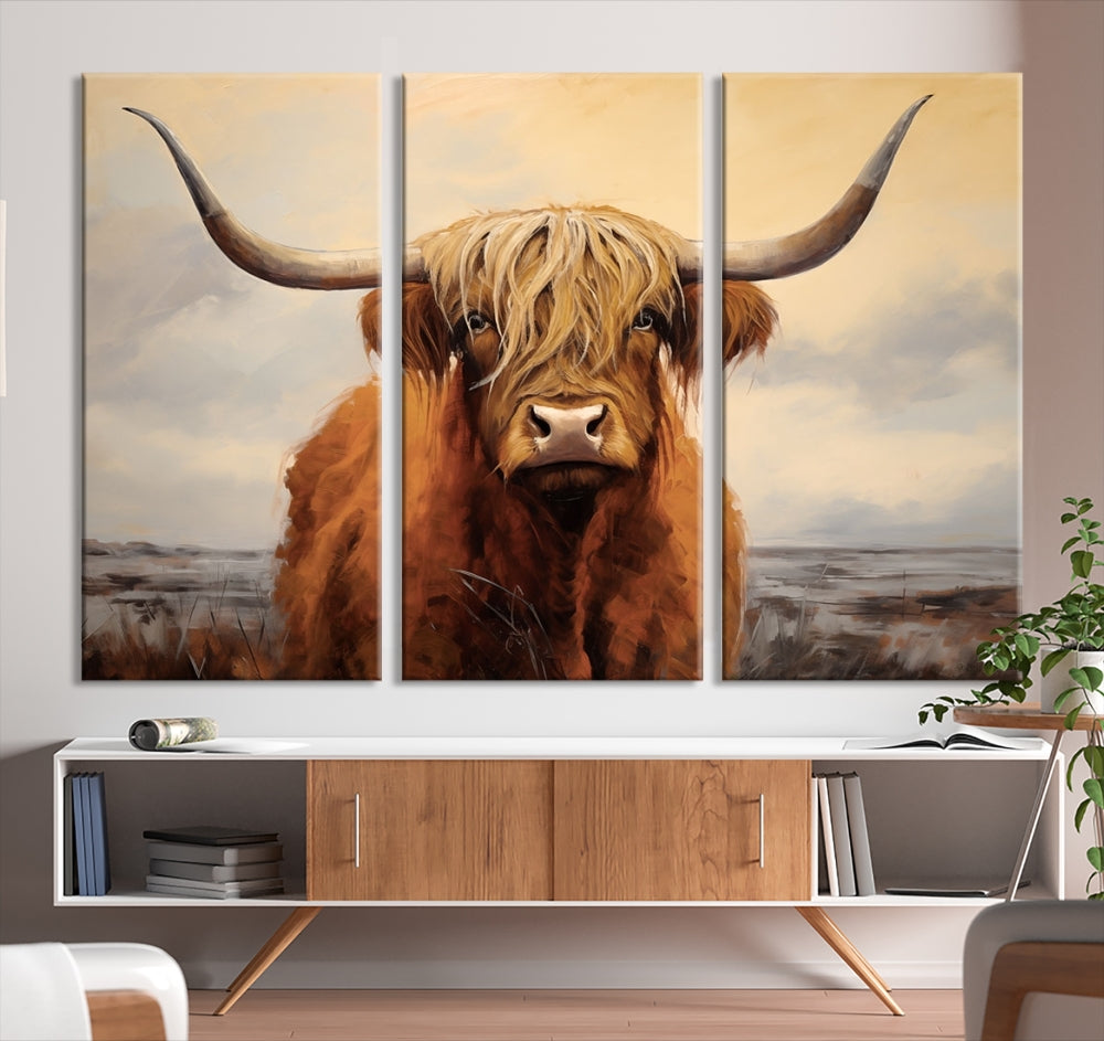 The Highland Cow Wall Art Canvas Print - Rustic Modern Decor, features a framed large panel showcasing a shaggy-haired cow with long horns, adding rustic charm to any space. Available in 3 or 5 pieces and ready to hang, it's perfect for the living room, office, or dining room.