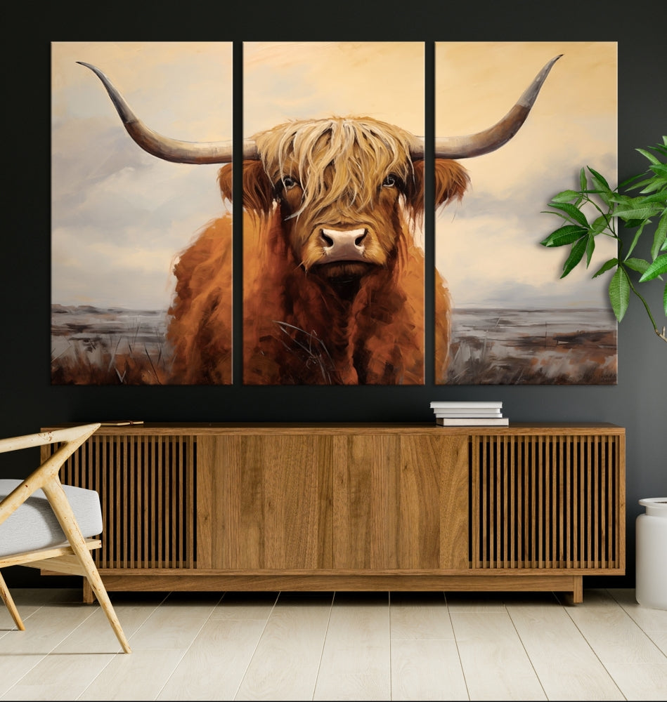 The Highland Cow Wall Art Canvas Print - Rustic Modern Decor, features a framed large panel showcasing a shaggy-haired cow with long horns, adding rustic charm to any space. Available in 3 or 5 pieces and ready to hang, it's perfect for the living room, office, or dining room.