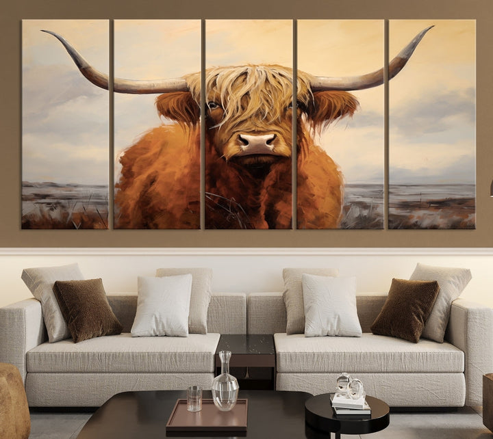 The Highland Cow Wall Art Canvas Print - Rustic Modern Decor, features a framed large panel showcasing a shaggy-haired cow with long horns, adding rustic charm to any space. Available in 3 or 5 pieces and ready to hang, it's perfect for the living room, office, or dining room.