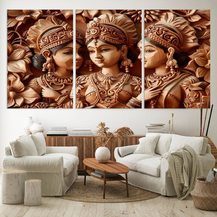 The Indian Woman Statue Wall Art Canvas Print, a three-panel wooden display showcasing intricate carved figures and utilizing lifetime inks for vibrant colors, was elegantly placed above the modern living room sofa.