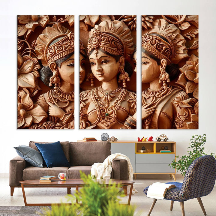 The Indian Woman Statue Wall Art Canvas Print, a three-panel wooden display showcasing intricate carved figures and utilizing lifetime inks for vibrant colors, was elegantly placed above the modern living room sofa.