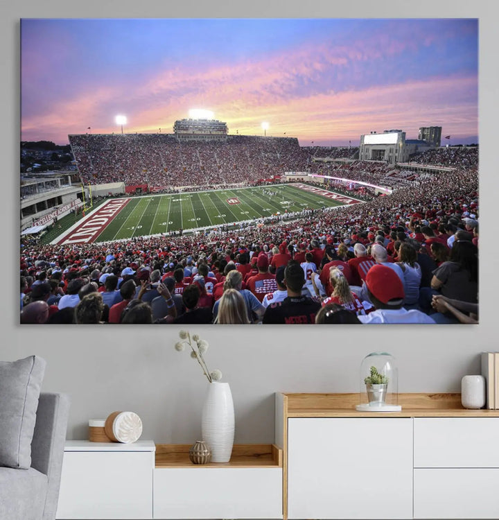 Living room featuring the Indiana University Hoosiers Football Team Print - Bloomington Memorial Stadium Wall Art Canvas Print, showcasing a packed football stadium at sunset for a gallery-quality finish.