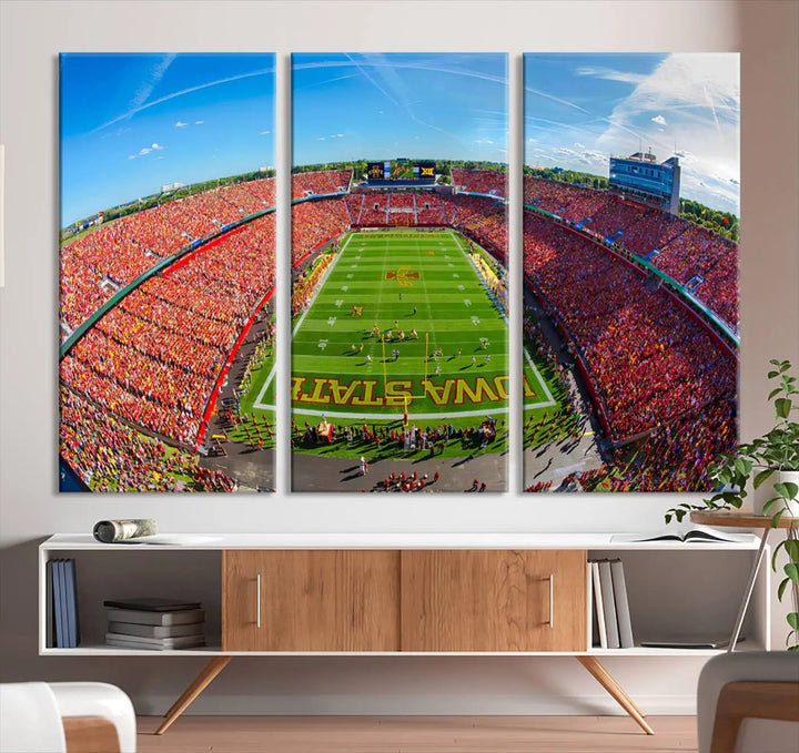 The Iowa State University Cyclones Football Team Print - Ames Jack Trice Stadium Wall Art Canvas Print features a panoramic view of a packed football stadium with vibrant red-clad fans. Handmade in the USA, this piece ensures exceptional quality and craftsmanship for your space.