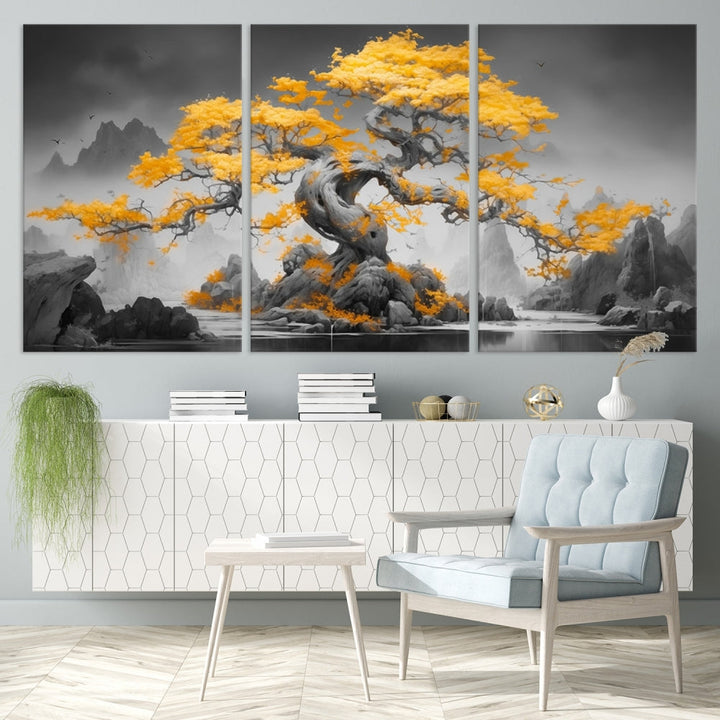 A Japanese Abstract Tree Wall Art Canvas Print showcases a vibrant yellow tree set against a misty, monochrome landscape. Each piece is gallery wrapped for lasting elegance.