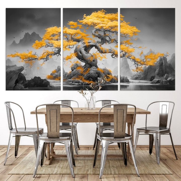 A Japanese Abstract Tree Wall Art Canvas Print showcases a vibrant yellow tree set against a misty, monochrome landscape. Each piece is gallery wrapped for lasting elegance.