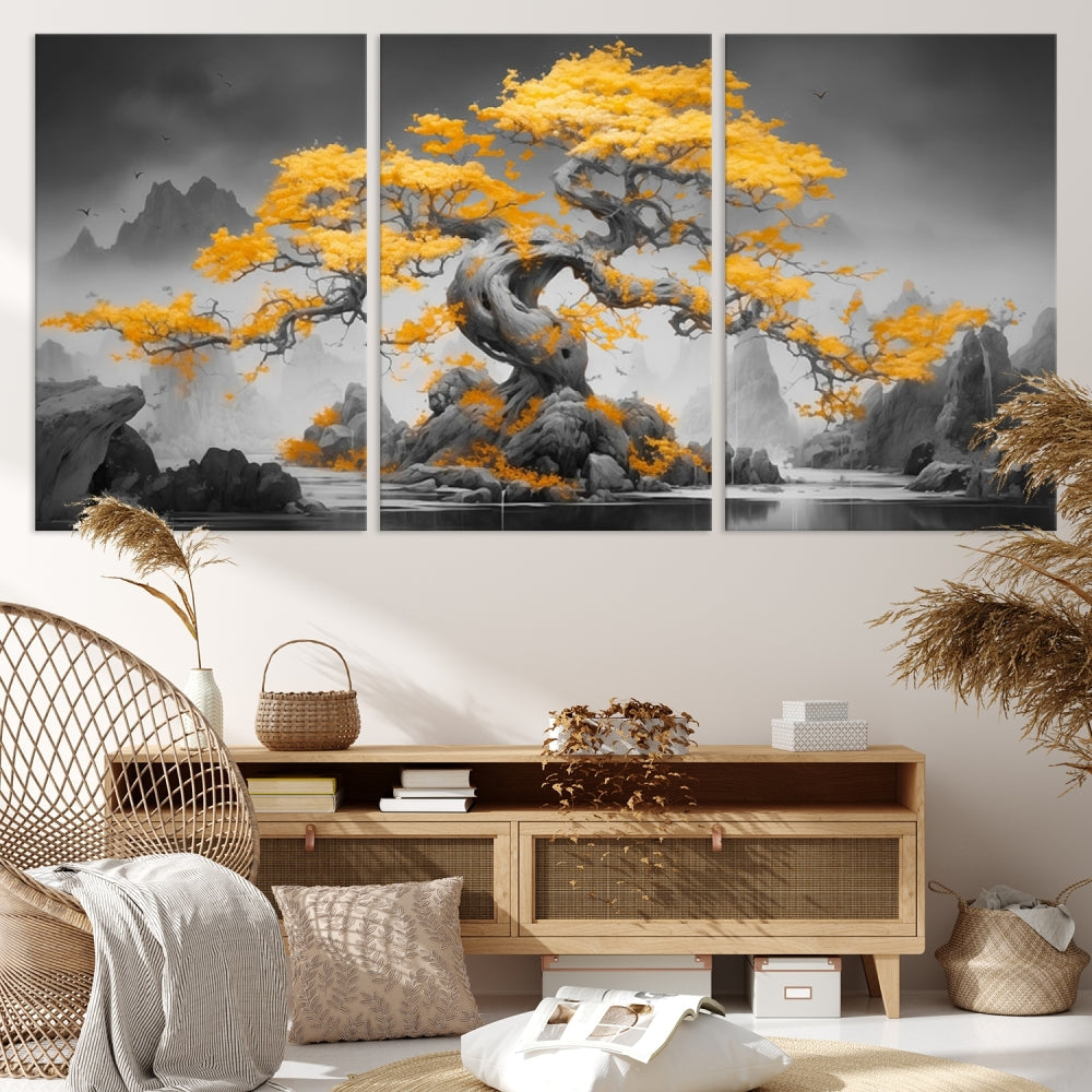 A Japanese Abstract Tree Wall Art Canvas Print showcases a vibrant yellow tree set against a misty, monochrome landscape. Each piece is gallery wrapped for lasting elegance.