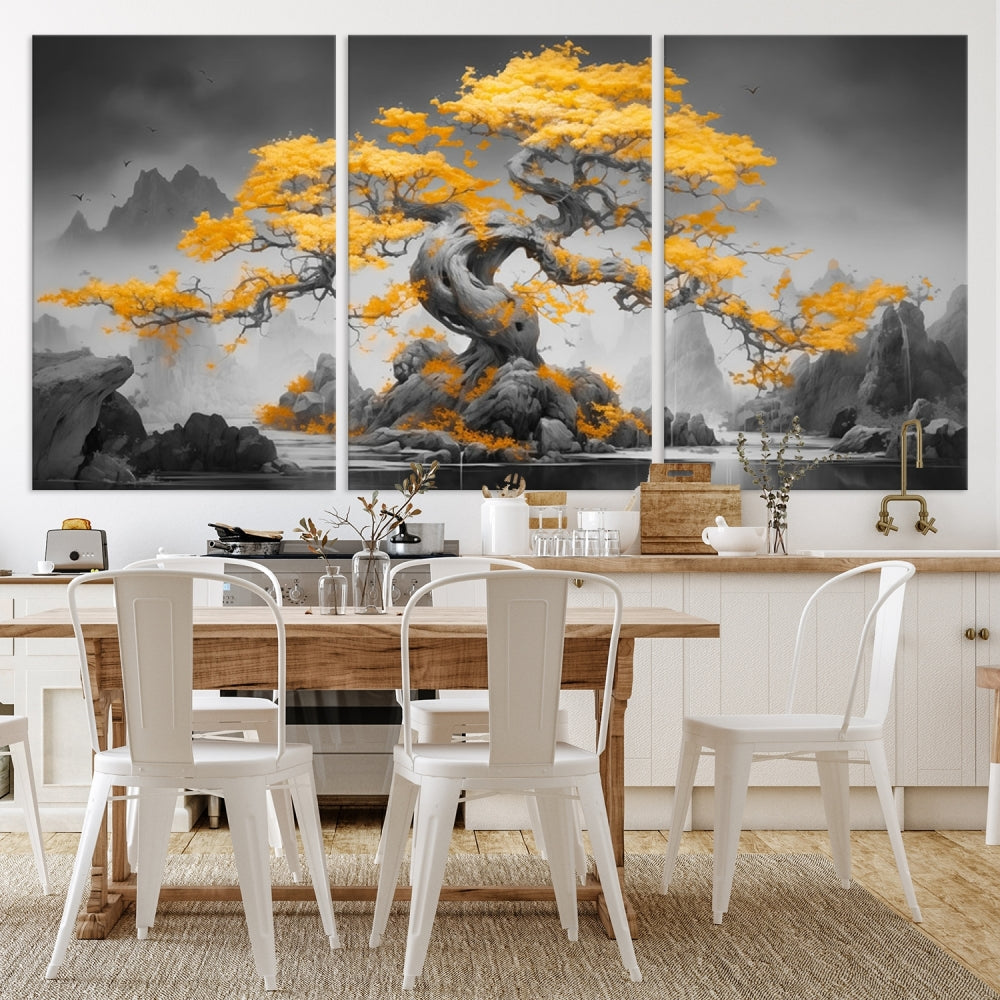 A Japanese Abstract Tree Wall Art Canvas Print showcases a vibrant yellow tree set against a misty, monochrome landscape. Each piece is gallery wrapped for lasting elegance.