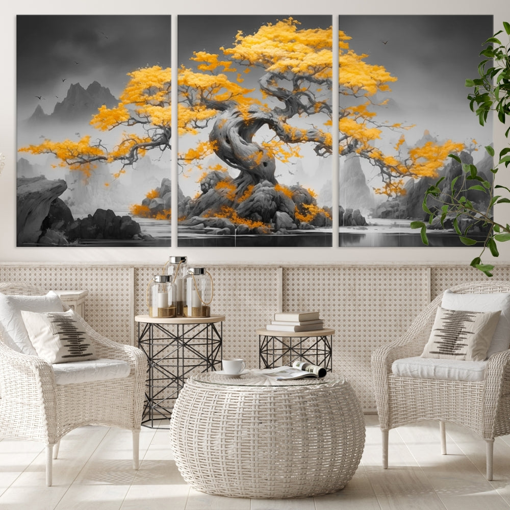 A Japanese Abstract Tree Wall Art Canvas Print showcases a vibrant yellow tree set against a misty, monochrome landscape. Each piece is gallery wrapped for lasting elegance.