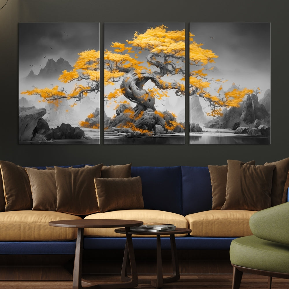 A Japanese Abstract Tree Wall Art Canvas Print showcases a vibrant yellow tree set against a misty, monochrome landscape. Each piece is gallery wrapped for lasting elegance.