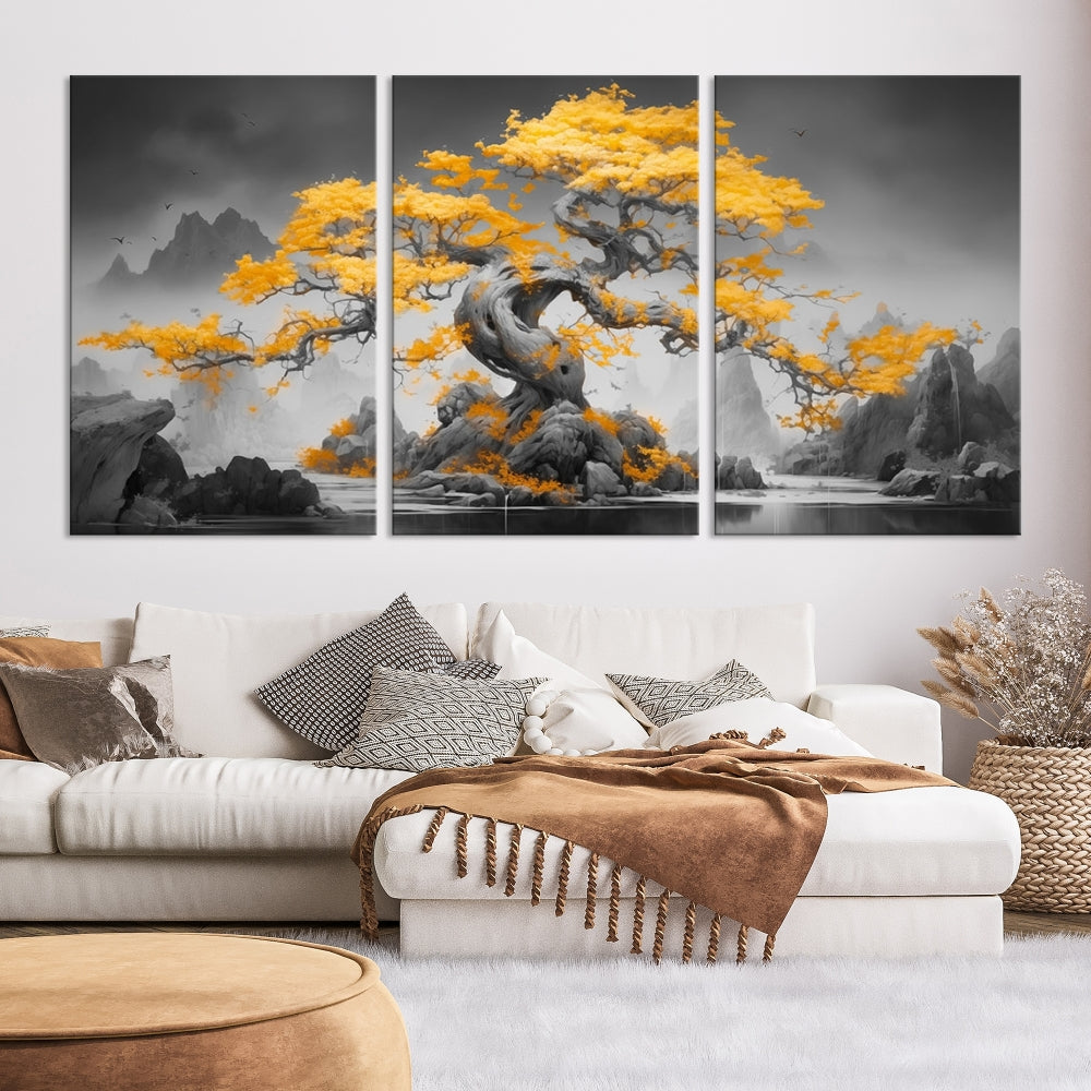 A Japanese Abstract Tree Wall Art Canvas Print showcases a vibrant yellow tree set against a misty, monochrome landscape. Each piece is gallery wrapped for lasting elegance.