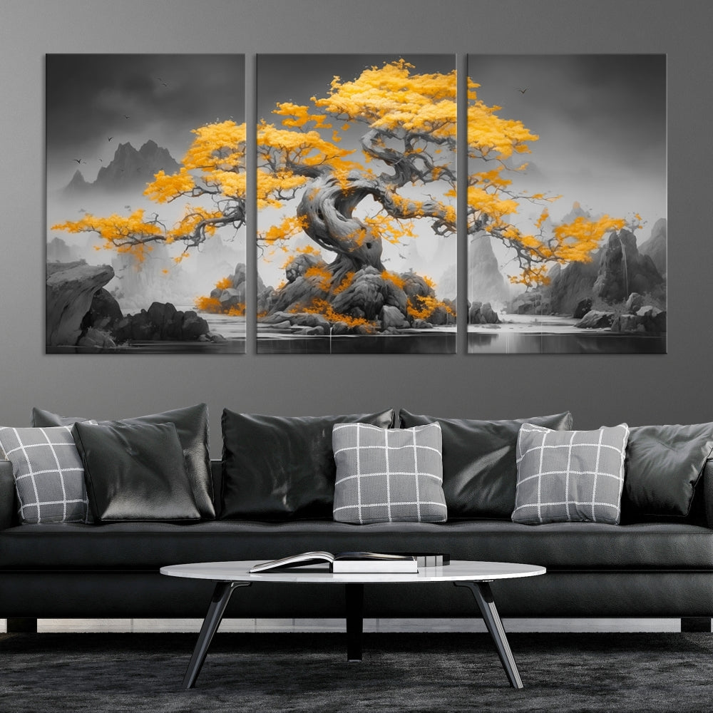 A Japanese Abstract Tree Wall Art Canvas Print showcases a vibrant yellow tree set against a misty, monochrome landscape. Each piece is gallery wrapped for lasting elegance.