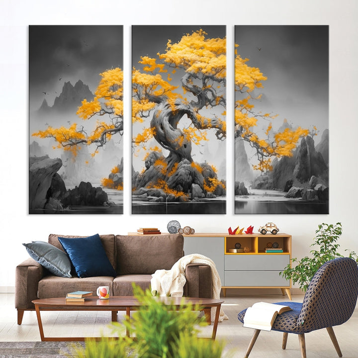 A Japanese Abstract Tree Wall Art Canvas Print showcases a vibrant yellow tree set against a misty, monochrome landscape. Each piece is gallery wrapped for lasting elegance.