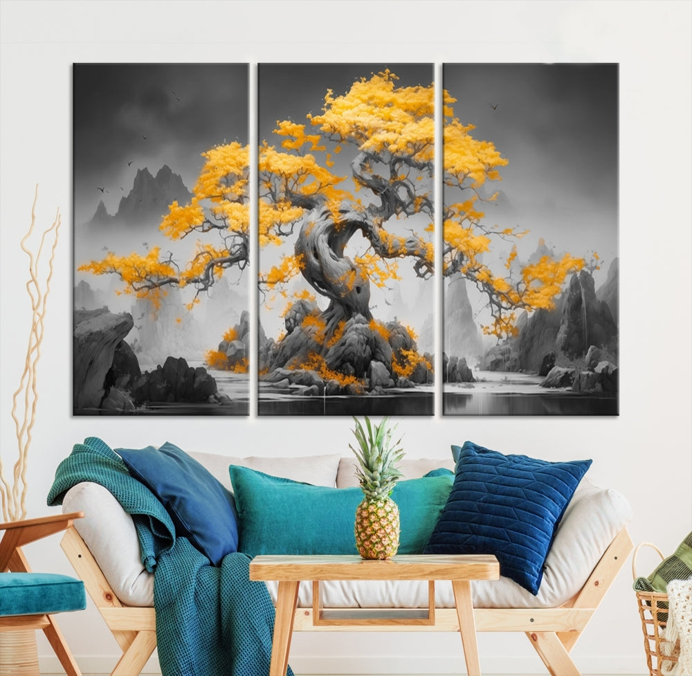 A Japanese Abstract Tree Wall Art Canvas Print showcases a vibrant yellow tree set against a misty, monochrome landscape. Each piece is gallery wrapped for lasting elegance.