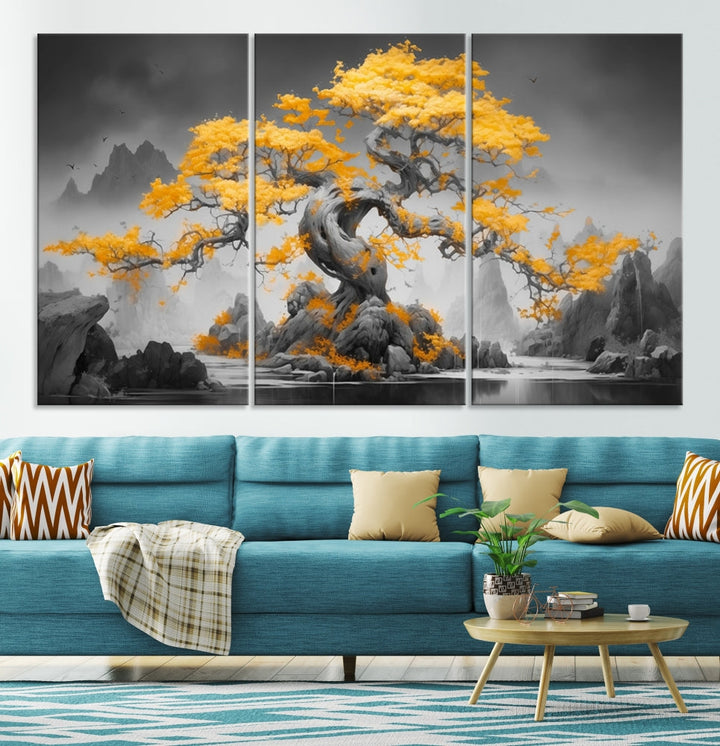 A Japanese Abstract Tree Wall Art Canvas Print showcases a vibrant yellow tree set against a misty, monochrome landscape. Each piece is gallery wrapped for lasting elegance.