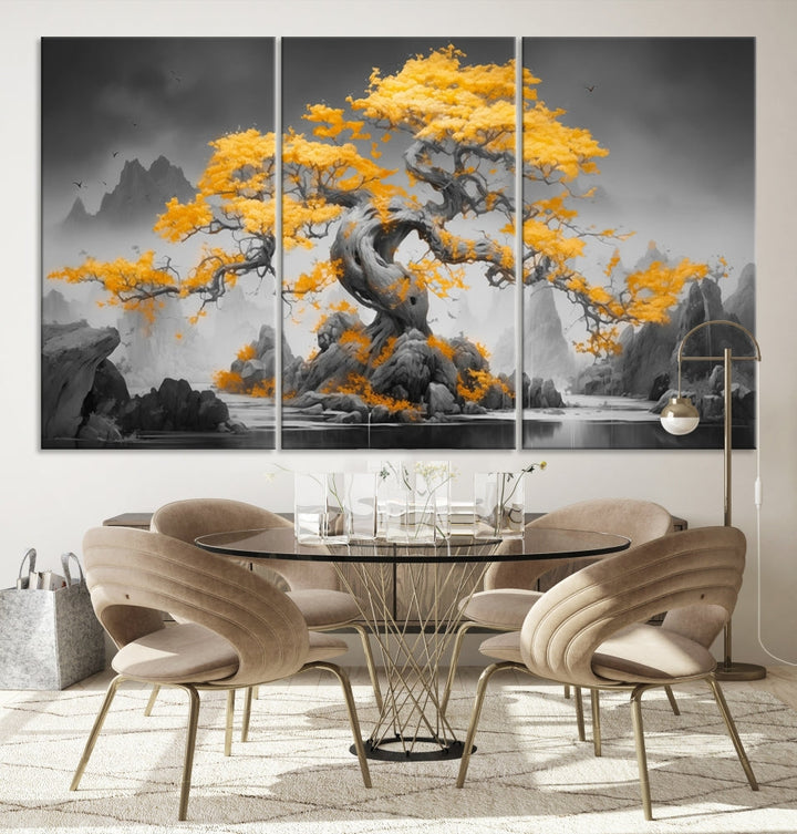 A Japanese Abstract Tree Wall Art Canvas Print showcases a vibrant yellow tree set against a misty, monochrome landscape. Each piece is gallery wrapped for lasting elegance.