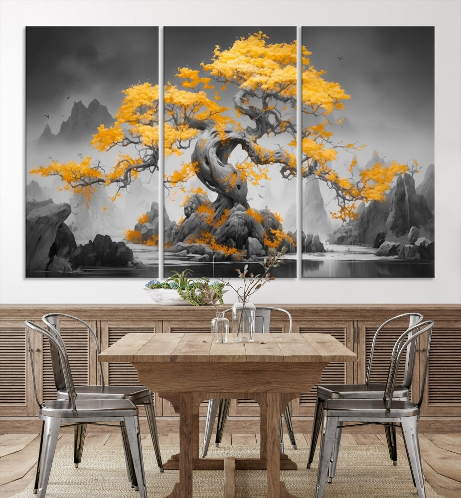 A Japanese Abstract Tree Wall Art Canvas Print showcases a vibrant yellow tree set against a misty, monochrome landscape. Each piece is gallery wrapped for lasting elegance.