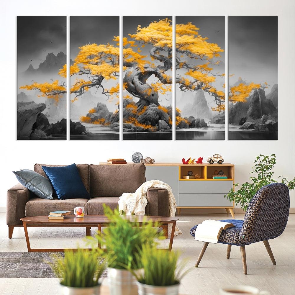 A Japanese Abstract Tree Wall Art Canvas Print showcases a vibrant yellow tree set against a misty, monochrome landscape. Each piece is gallery wrapped for lasting elegance.