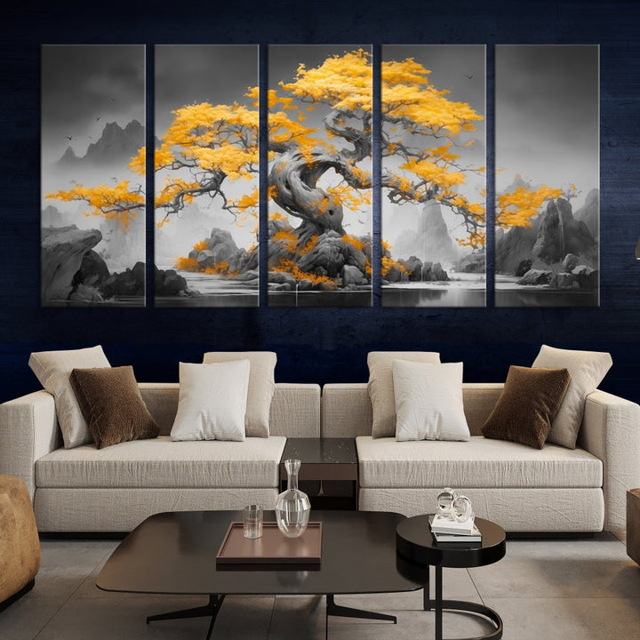 A Japanese Abstract Tree Wall Art Canvas Print showcases a vibrant yellow tree set against a misty, monochrome landscape. Each piece is gallery wrapped for lasting elegance.