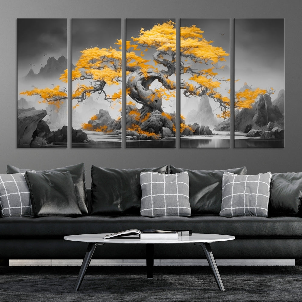 A Japanese Abstract Tree Wall Art Canvas Print showcases a vibrant yellow tree set against a misty, monochrome landscape. Each piece is gallery wrapped for lasting elegance.