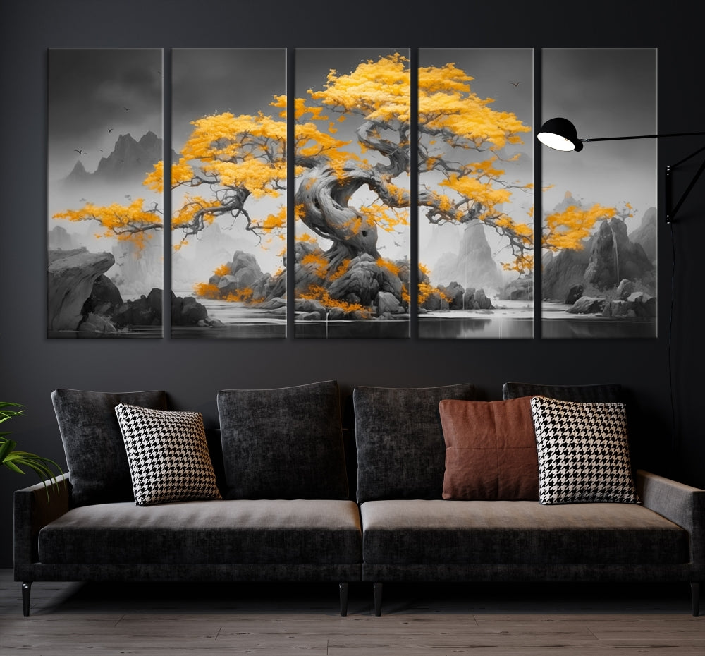 A Japanese Abstract Tree Wall Art Canvas Print showcases a vibrant yellow tree set against a misty, monochrome landscape. Each piece is gallery wrapped for lasting elegance.