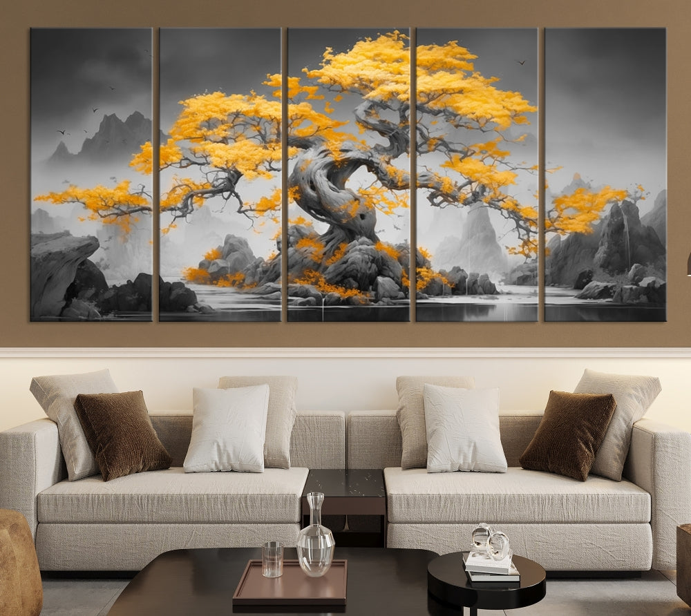 A Japanese Abstract Tree Wall Art Canvas Print showcases a vibrant yellow tree set against a misty, monochrome landscape. Each piece is gallery wrapped for lasting elegance.