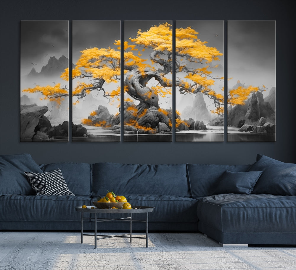 A Japanese Abstract Tree Wall Art Canvas Print showcases a vibrant yellow tree set against a misty, monochrome landscape. Each piece is gallery wrapped for lasting elegance.