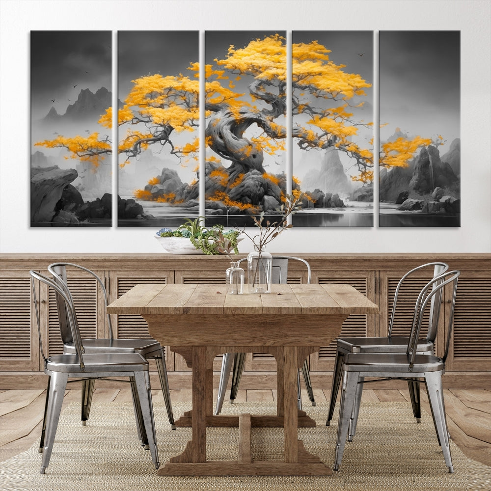 A Japanese Abstract Tree Wall Art Canvas Print showcases a vibrant yellow tree set against a misty, monochrome landscape. Each piece is gallery wrapped for lasting elegance.