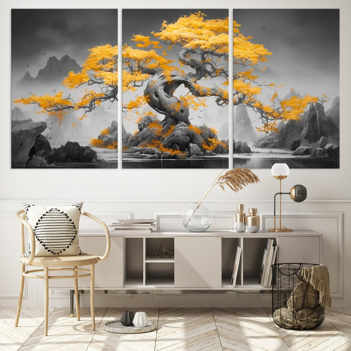 A Japanese Abstract Tree Wall Art Canvas Print showcases a vibrant yellow tree set against a misty, monochrome landscape. Each piece is gallery wrapped for lasting elegance.