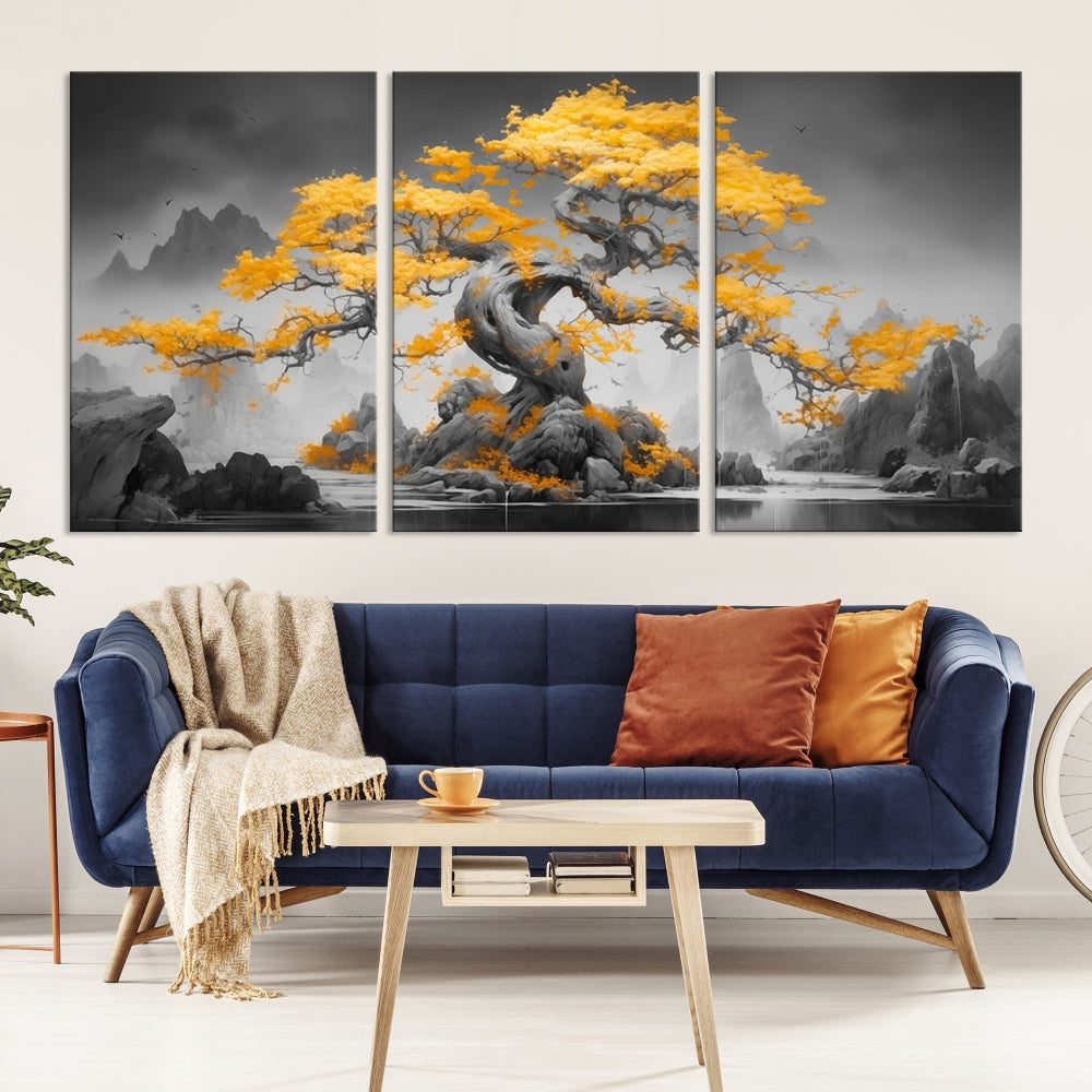 A Japanese Abstract Tree Wall Art Canvas Print showcases a vibrant yellow tree set against a misty, monochrome landscape. Each piece is gallery wrapped for lasting elegance.