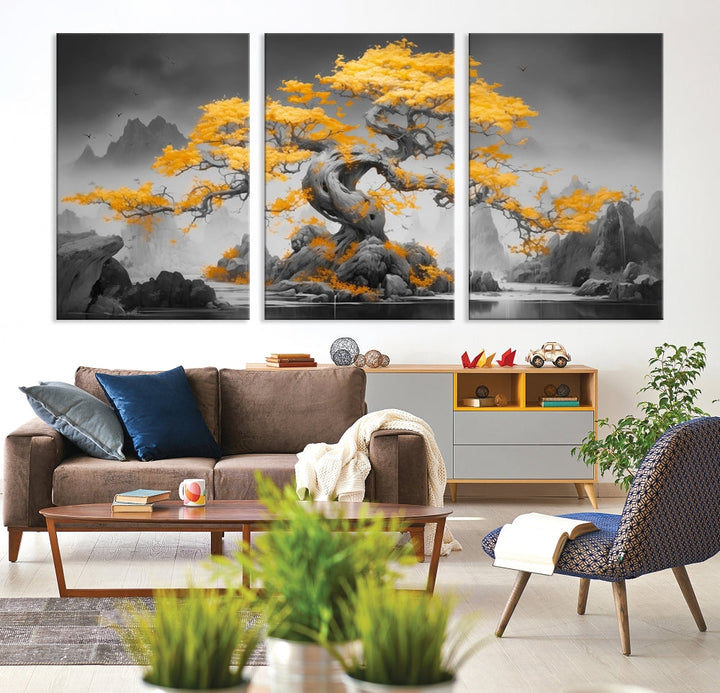 A Japanese Abstract Tree Wall Art Canvas Print showcases a vibrant yellow tree set against a misty, monochrome landscape. Each piece is gallery wrapped for lasting elegance.