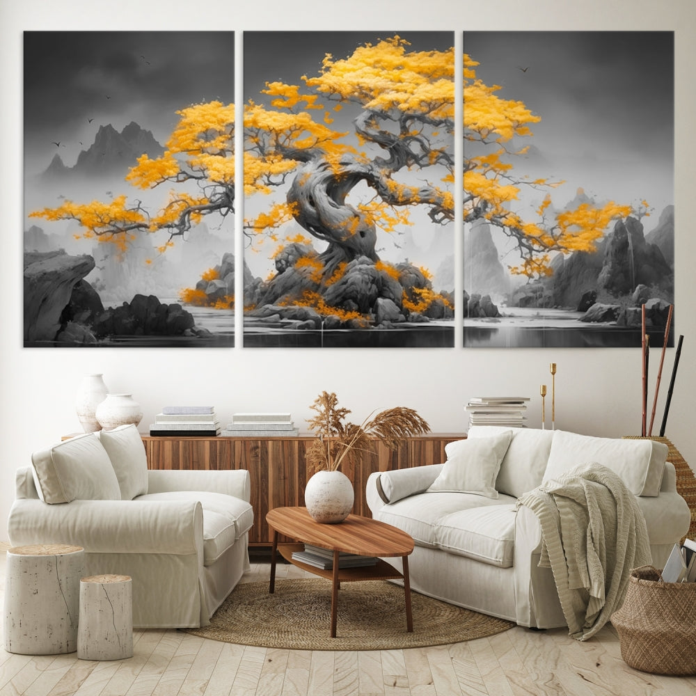 A Japanese Abstract Tree Wall Art Canvas Print showcases a vibrant yellow tree set against a misty, monochrome landscape. Each piece is gallery wrapped for lasting elegance.