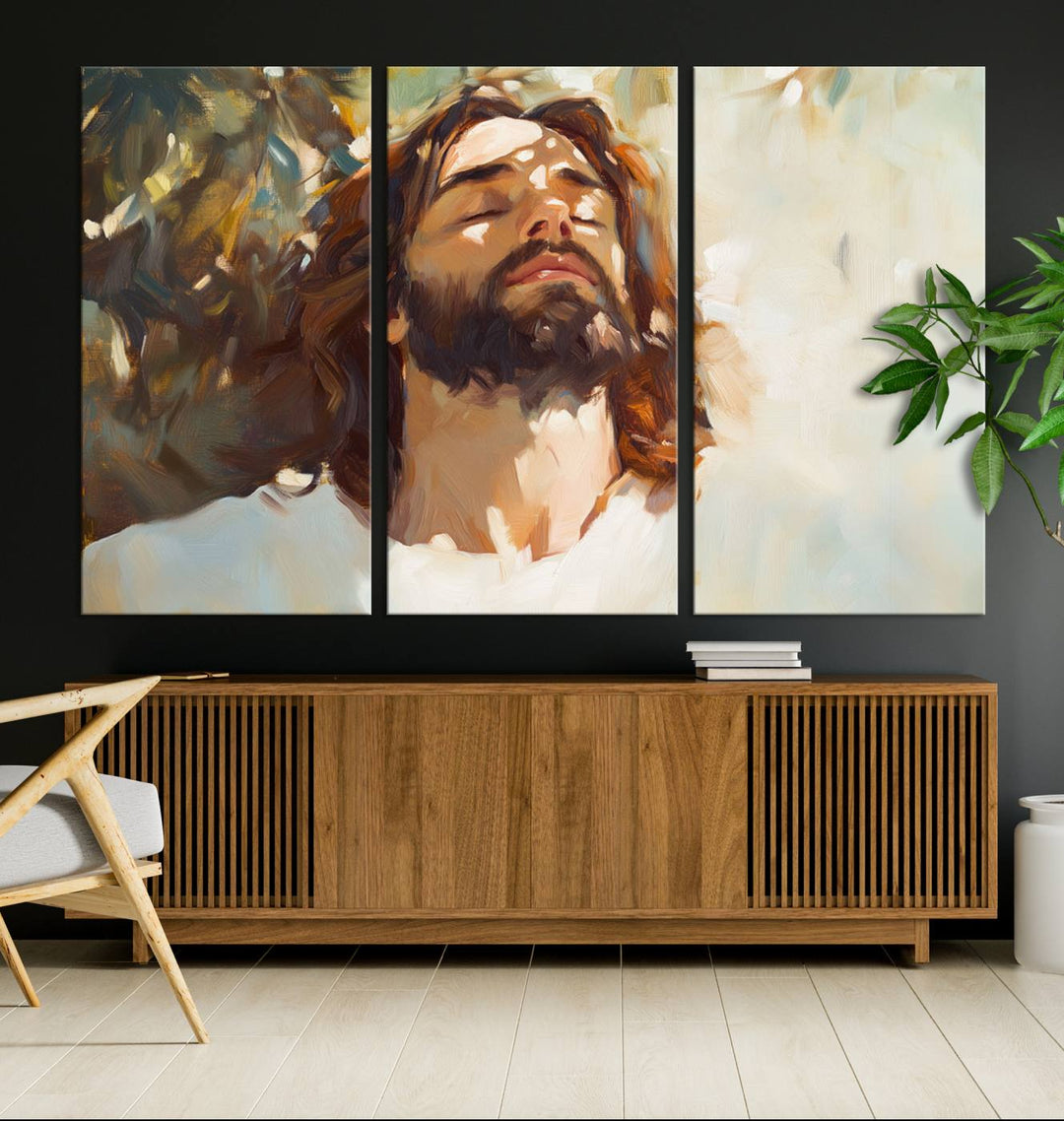 The Jesus Portrait Wall Art Canvas Print features a depiction of Jesus Christ with closed eyes, basking in sunlight. His expression exudes a peaceful, spiritual atmosphere against a blurred background.