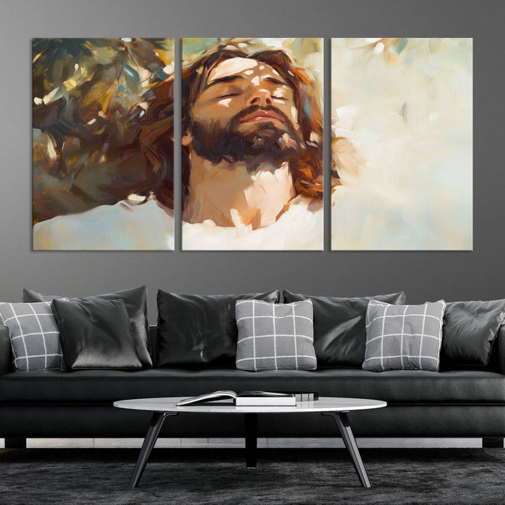 The Jesus Portrait Wall Art Canvas Print features a depiction of Jesus Christ with closed eyes, basking in sunlight. His expression exudes a peaceful, spiritual atmosphere against a blurred background.