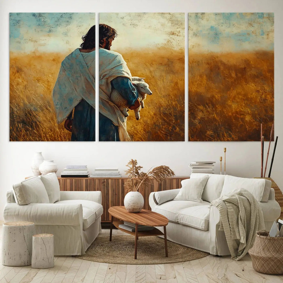 The Jesus the Good Shepherd Wall Art Canvas Print, featuring a figure in a robe holding a lamb amidst a golden field at sunset, adds serene beauty to the wall and embodies inspirational Christian decor.