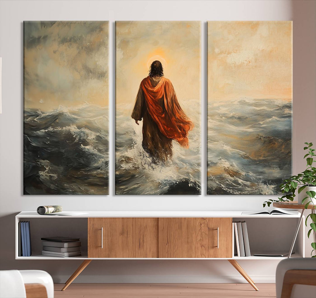 This triptych wall art, titled "Jesus Walking on Water," presents a figure in a red cloak crossing turbulent seas. It is perfect for those looking for religious home decor with a contemporary flair.