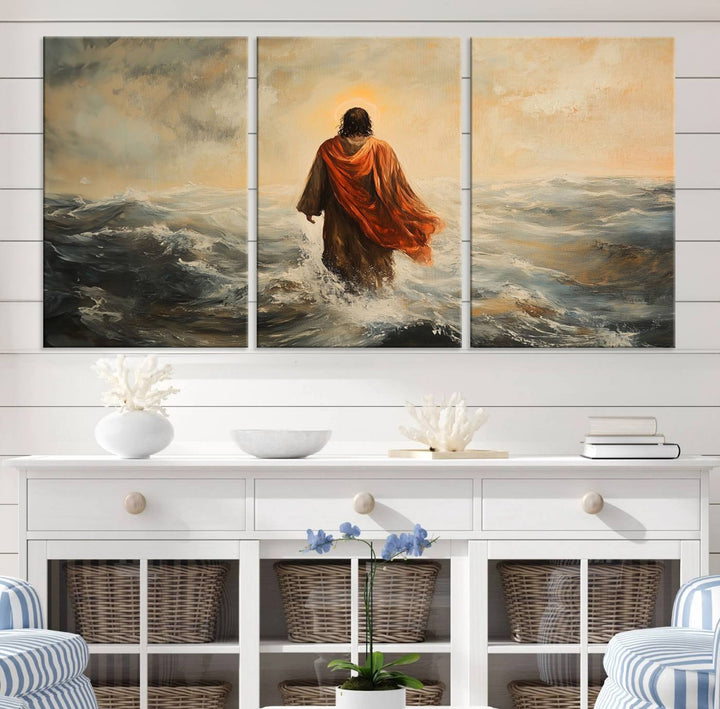 This triptych wall art, titled "Jesus Walking on Water," presents a figure in a red cloak crossing turbulent seas. It is perfect for those looking for religious home decor with a contemporary flair.