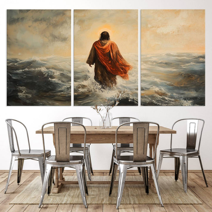 This triptych wall art, titled "Jesus Walking on Water," presents a figure in a red cloak crossing turbulent seas. It is perfect for those looking for religious home decor with a contemporary flair.