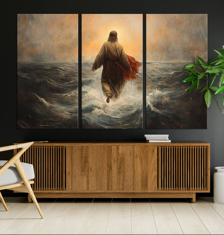 A wall art piece titled Jesus Walking on Water is prominently displayed above a modern living room sofa.