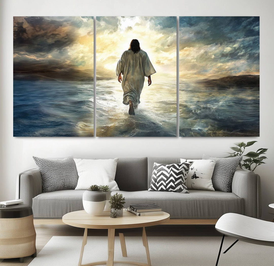 The Jesus Walking on Water Wall Art, a captivating triptych canvas print, showcases a person walking on water beneath dramatic clouds. This ready-to-hang piece seamlessly combines faith and style for your Christian home decor.