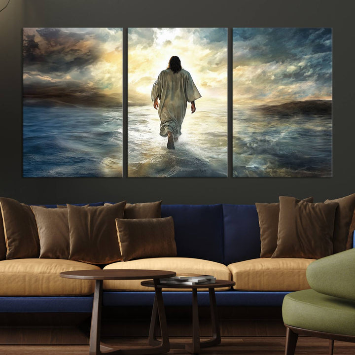 The Jesus Walking on Water Wall Art, a captivating triptych canvas print, showcases a person walking on water beneath dramatic clouds. This ready-to-hang piece seamlessly combines faith and style for your Christian home decor.